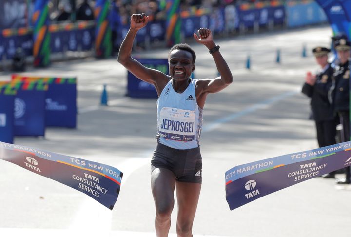 Kenya's Joyciline Jepkosgei crosses the line to win the women's elite race.