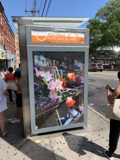 Elle Pérez's 'Roses' (2019) at a bus stop in the Tompkinsville