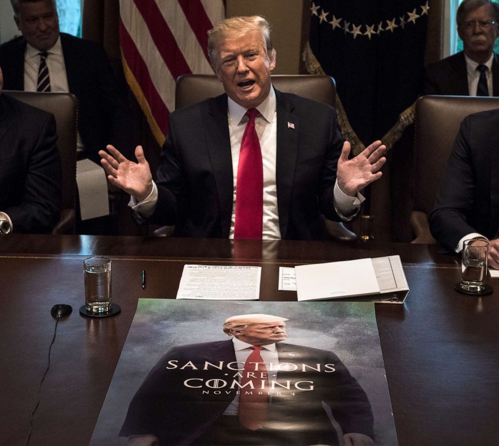 PHOTO: President Donald Trump leads a meeting of his Cabinet with a poster featuring him spread out on the conference table on Jan. 02, 2019, in Washington.
