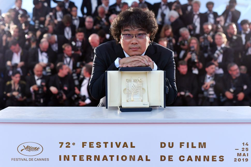 Bong Joon-ho with the prestigious Palme d'Or award at the Cannes Film Festival on May 25, 2019.
