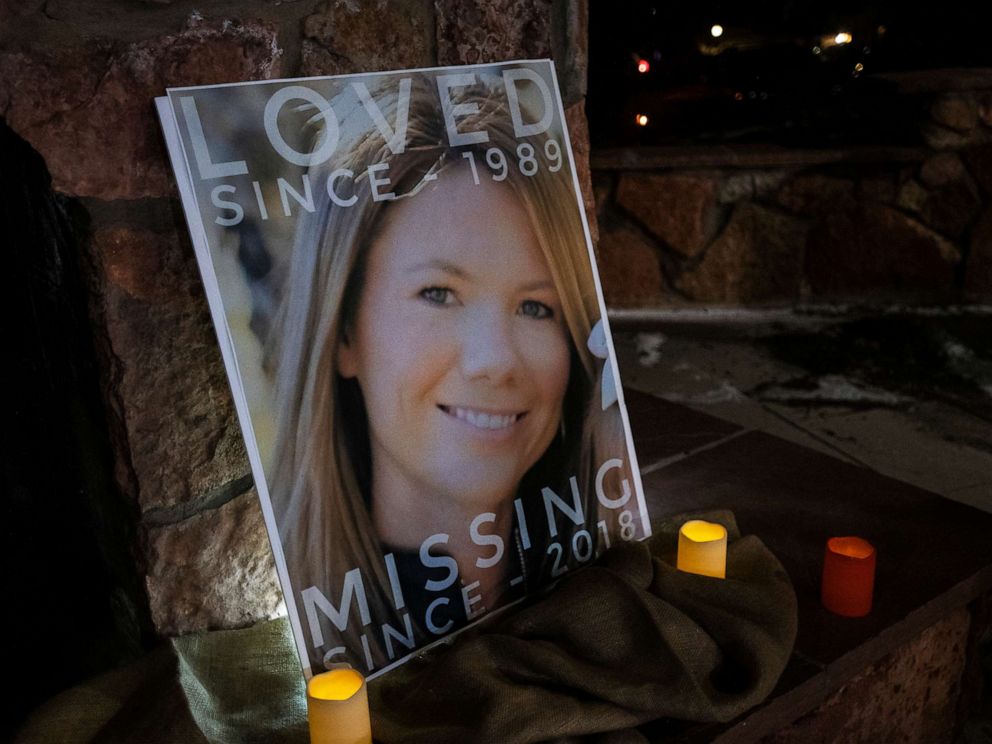 PHOTO: In this Dec. 13, 2018 file photo, a poster with the picture of missing Kelsey Berreth is propped up with candles for a vigil at Memorial Park in Woodland Park, Colo.