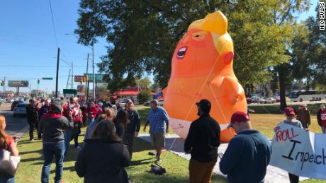 A 20-foot tall balloon resembling President Trump has made an appearance at the highly anticipated college football game between the University of Alabama and Louisiana State University.