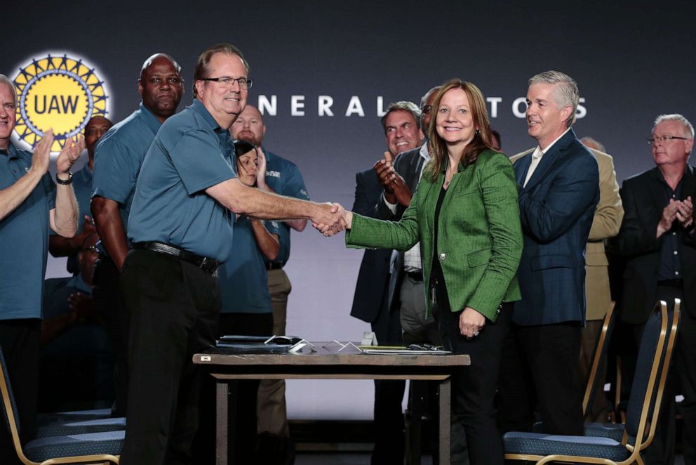 PHOTO: Mary Barra, Chairman and CEO of General Motors Co. and Gary Jones, president of the United Auto Workers, shake hands during a GM event at the Renaissance Center in Detroit, July 16, 2019.