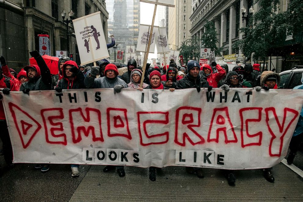 PHOTO: Braving snow and cold temperatures, thousands marched through the streets near City Hall during the 11th day of an ongoing teachers strike on Oct. 31, 2019 in Chicago.
