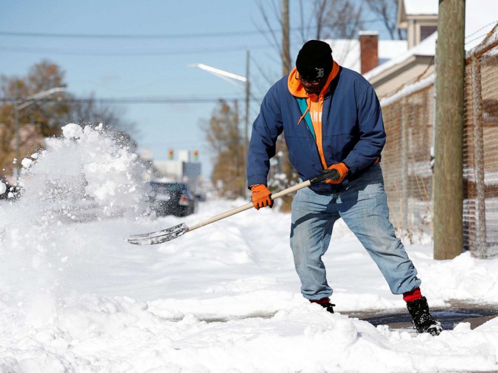 PHOTO: Kevin Strickland shovels snow from a sidewalk in Detroit, Michigan, Nov. 12, 2019.