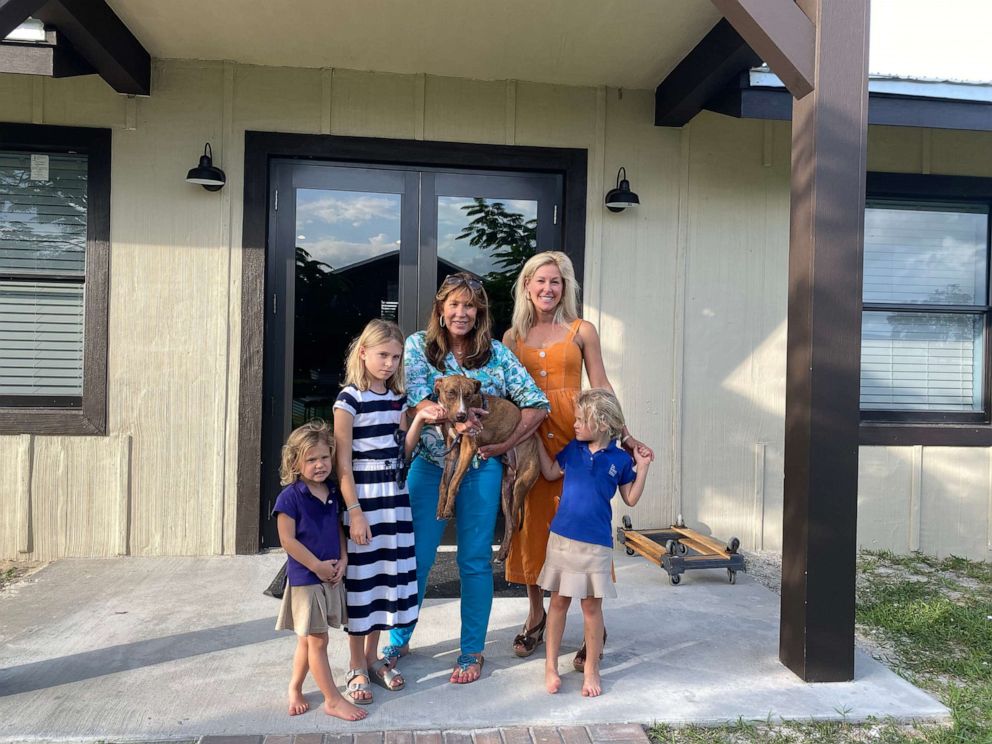 PHOTO: Clare Beaty, Jayne Beaty, Big Dog Ranch Rescue founder/president Lauree Simmons; mother Briana Beaty; and Kate Beaty take a photo with Miracle.