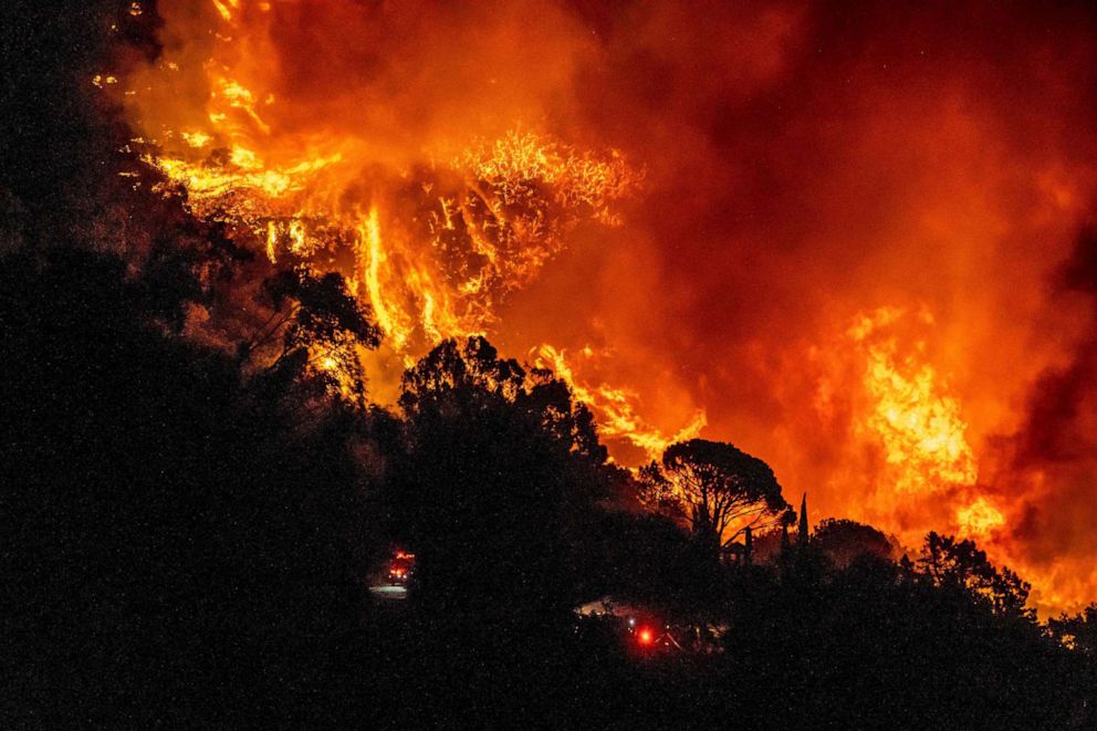 PHOTO: The Cave Fire burns a hillside near homes in Santa Barbara, Calif., November 26, 2019.