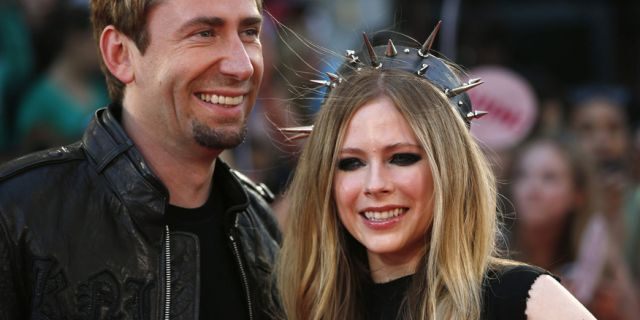 Singers Avril Lavigne and Chad Kroeger arrive on the red carpet for the Much Music Video Awards on June 16, 2013, in Toronto, Canada.