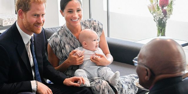 Britain's Duke and Duchess of Sussex, Prince Harry and his wife Meghan Markle hold their baby son Archie as they meet with Archbishop Desmond Tutu at the Tutu Legacy Foundation in Cape Town on Sept. 25, 2019. 