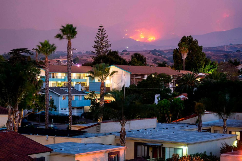 PHOTO: The Cave fire burns a hillside above houses in Santa Barbara, Calif., Nov. 26, 2019.