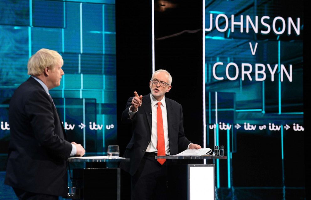 PHOTO: A handout picture taken and released by ITV on Nov. 19, 2019, shows Jeremy Corbyn and Prime Minister Boris Johnson as they debate on the set of Johnson v Corbyn: The ITV Debate in Salford, north-west England.