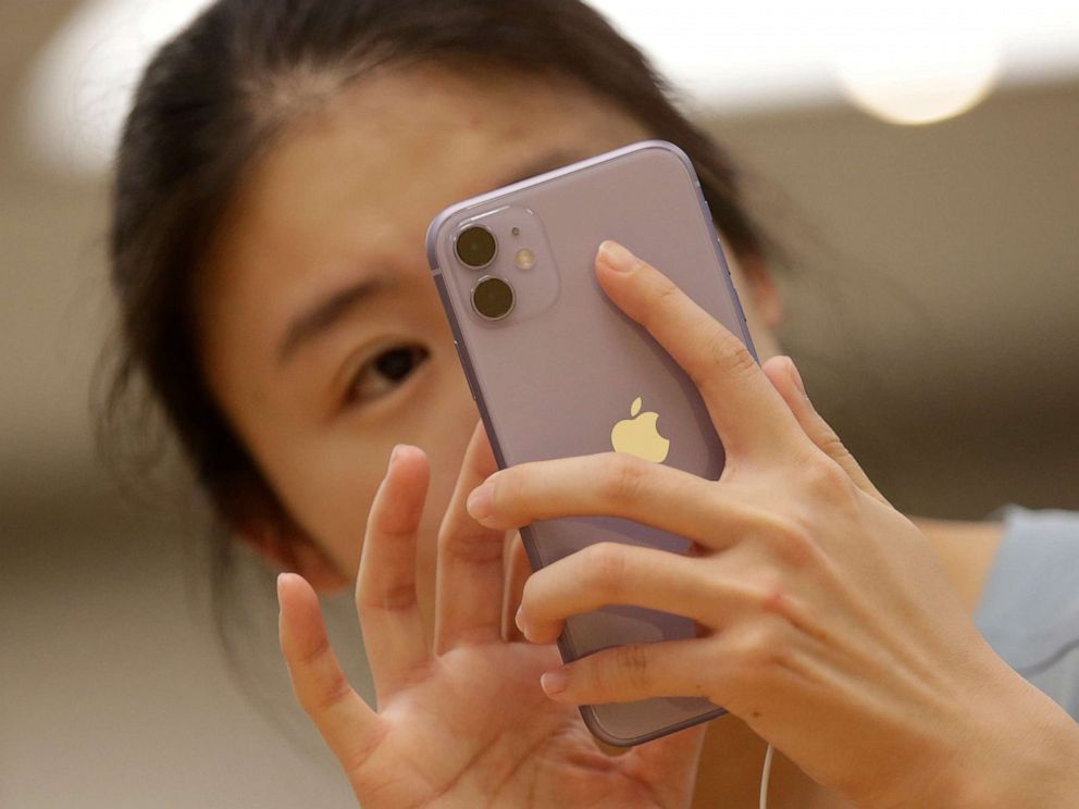 PHOTO: A customer tests Apples iPhone 11 after it went on sale at the Apple Store in Beijing, China, Sept. 20, 2019.