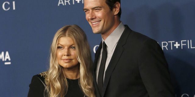 Actor Josh Duhamel and singer Fergie pose at an event in 2013.