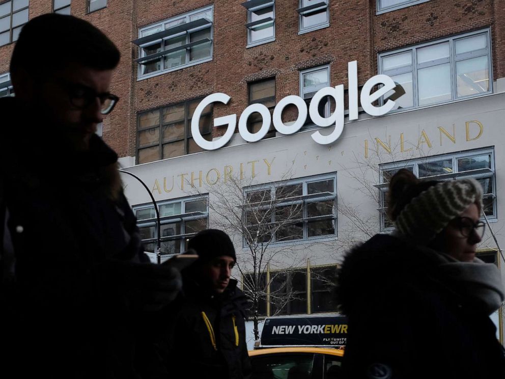 PHOTO: People walk past a Google office building on 9th Avenue in Chelsea district in New York, Dec. 30, 2017.