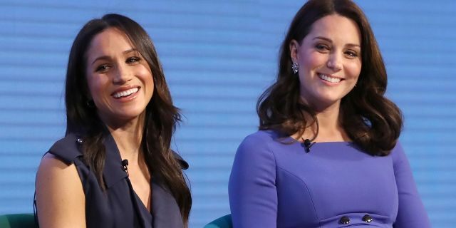 Meghan Markle (left) with Kate Middleton during happier times.