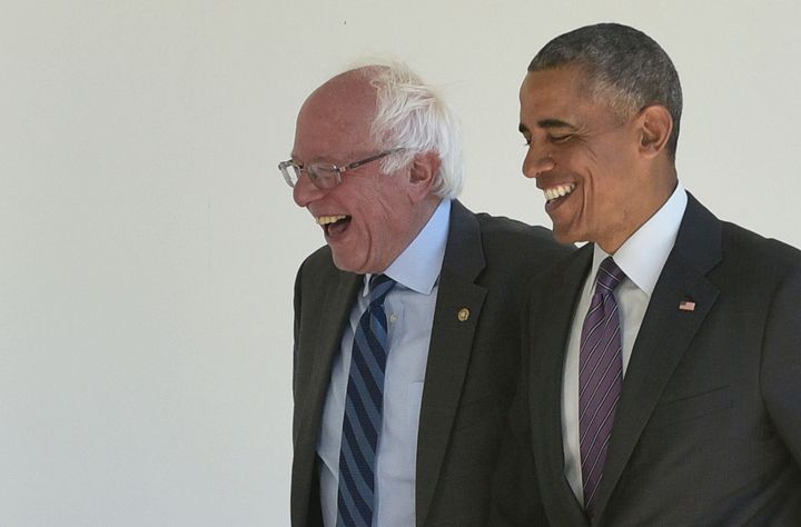 Then-President Barack Obama, right, walks with 2016 Democratic presidential candidate Sen. Bernie Sanders of Vermont at the W