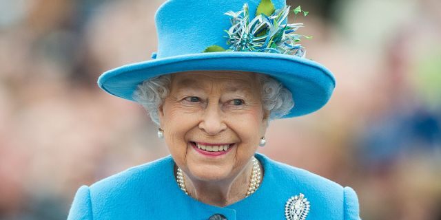 Queen Elizabeth II tours Queen Mother Square on October 27, 2016, in Poundbury, Dorset.