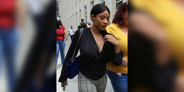 R. Kelly's girlfriend, Jocelyn Savage (L), leaves after a hearing in the racketeering and sex trafficking case of Kelly at Brooklyn federal court on August 2, 2019 in New York. - R&amp;B singer R. Kelly pleaded not guilty in a New York court to federal charges including racketeering that allege he systematically recruited girls for sex while touring. 