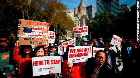 People take part in a kick-off rally of the &quot;Home Is Here&quot; March for DACA and TPS on October 26 in New York City.