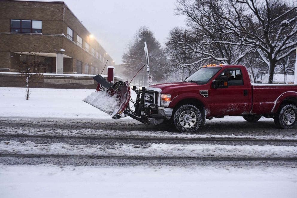 PHOTO: A snowplow truck drives by after a blizzard struck overnight, Nov. 27, 2019, in Minneapolis.