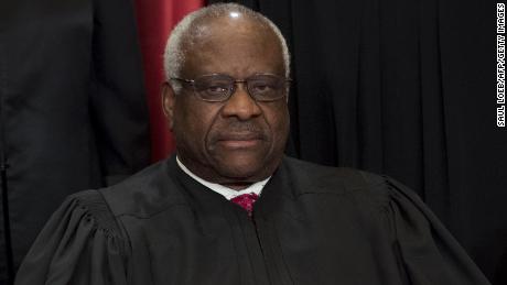 Justice Clarence Thomas sits for an official photo in 2017 with other members of the US Supreme Court.