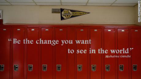 Photos and signs about Mario&#39;s case aren&#39;t the only calls to action on the walls at Wilbur Cross. A Mahatma Gandhi quote is painted on lockers on the third floor of the school.