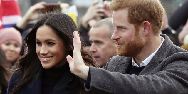 Britain's Prince Harry and Meghan Markle during a walkabout with Britain's Prince Harry on the esplanade at Edinburgh Castle.