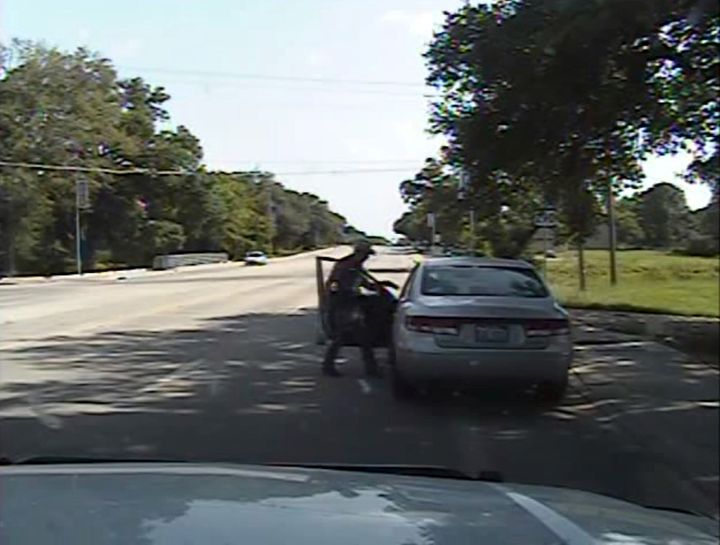 Texas state trooper Brian Encinia points a Taser at Sandra Bland during a traffic stop in this still image captured from his 