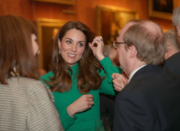 The Duchess of Cambridge greets guests at Buckingham Palace on Dec. 3 during a reception hosted by Queen Elizabeth II ahead o