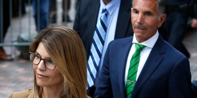 Actress Lori Loughlin, left, leaves as her husband Mossimo Giannulli, right, are asking a court to give them access to evidence they believe will help in their defense. 