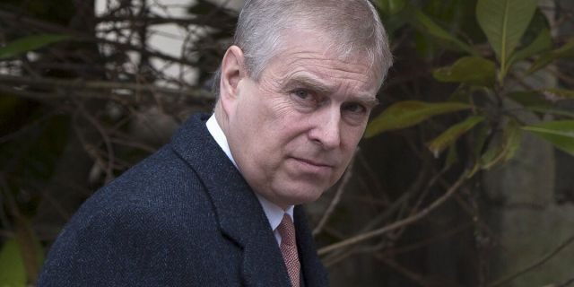 Britain's Prince Andrew leaves after attending the Easter Sunday service at St Georges Chapel at Windsor Castle in southern England.