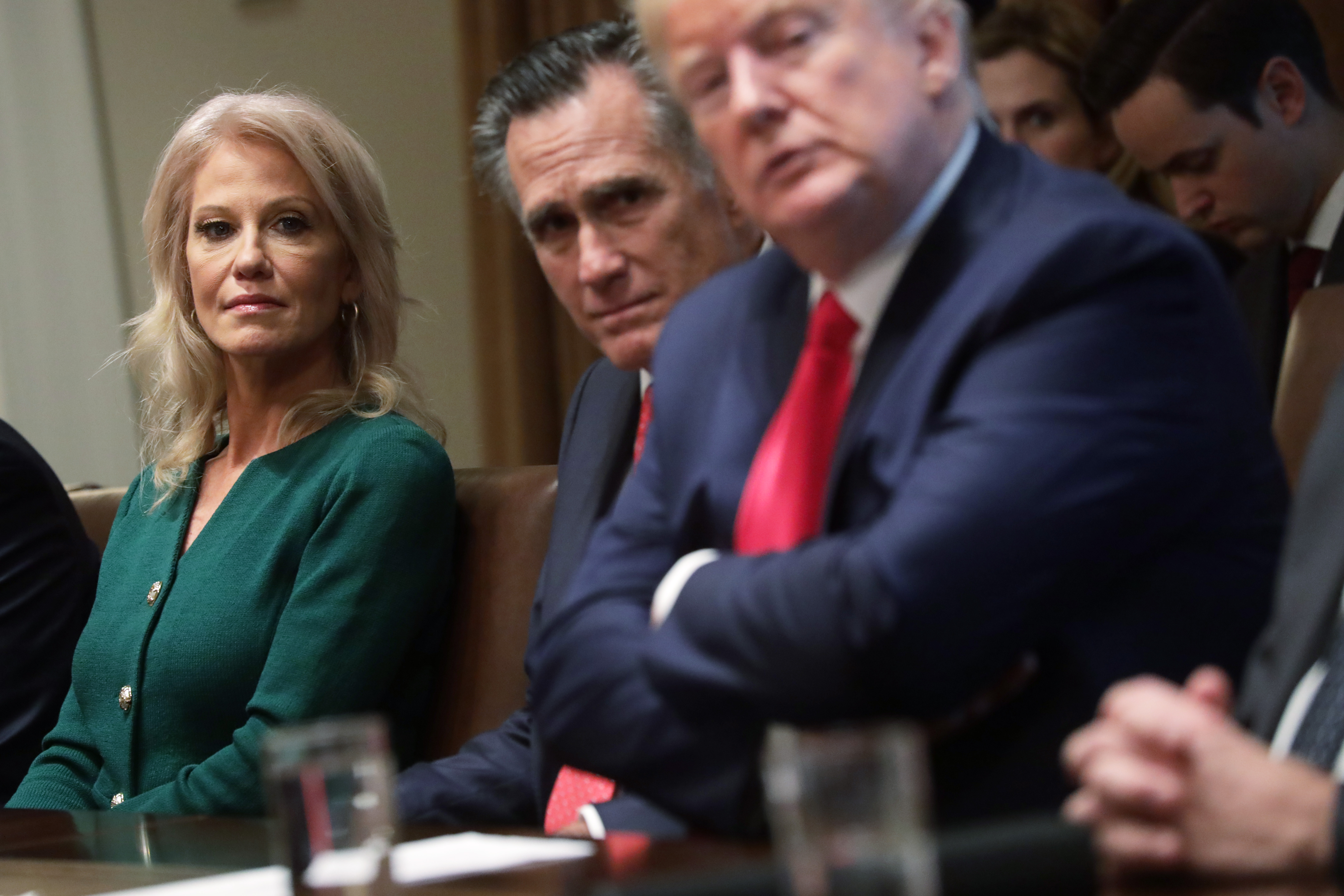 White House senior counselor Kellyanne Conway, Sen. Mitt Romney and President Donald Trump listen during a listening session on youth vaping on November 22, 2019.