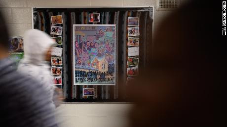 A bulletin board dedicated to Mario Aguilar hangs in the hallway at Wilbur Cross High School in New Haven, Connecticut. Since ICE detained him in September, students, teachers and administrators at the school have been pushing for his release.