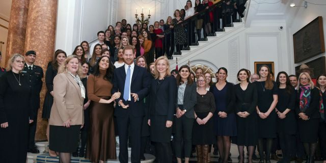 Britain's Prince Harry and Meghan, Duchess of Sussex with the High Commissioner for Canada in the UK, Janice Charette, center left, and the deputy High Commissioner, Sarah Fountain Smith, center right, pose for a photograph with High Commission staff during their visit to Canada House, central London, to thank them for the warm hospitality and support they received during their recent stay in Canada, in London, Tuesday, Jan. 7, 2020.