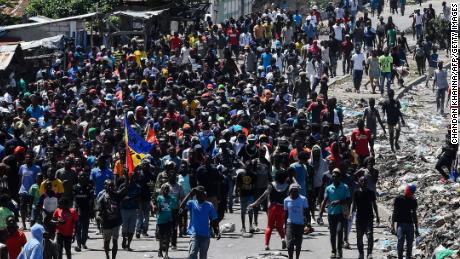 People march in Cite Soleil during the anti-government protest on September 27, 2019. 