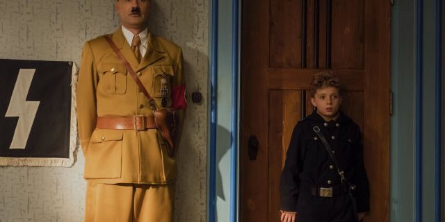 This image released by Fox Searchlight Pictures shows Taika Waititi, left, and Roman Griffin Davis in a scene from "Jojo Rabbit."