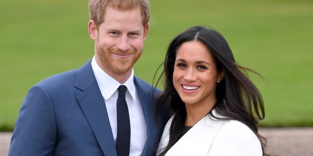 Prince Harry and Meghan Markle attend an official photocall to announce their engagement at The Sunken Gardens at Kensington Palace on November 27, 2017.