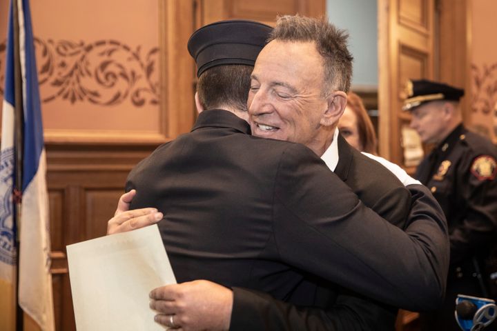 Bruce Springsteen embraced his son Sam Springsteen after he was sworn in as a firefighter.