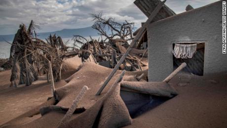  Houses near Taal volcano&#39;s crater are seen buried in volcanic ash from the volcano&#39;s eruption.