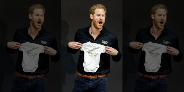 Prince Harry, Duke of Sussex is presented with an Invictus Games baby grow for his newborn son Archie during the launch of the Invictus Games on May 9, 2019 in The Hague, Netherlands.