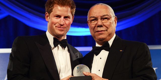 Prince Harry receives the Distinguished Humanitarian Leadership Award presented by former Secretary of State Colin Powell during the Atlantic Council 2012 Annual Awards Dinner at a hotel in Washington, DC, on May 7, 2012. Prince Harry joined a black-tie dinner in Washington to accept a humanitarian prize for his work supporting charities that help injured British and U.S. military personnel.