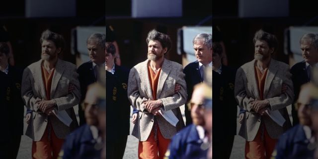 Police officers bring Theodore Kaczynski, aka the Unabomber, to court for arraignment. Kaczynski later pled guilty to the mail bomb attacks that killed three people and injured 23.