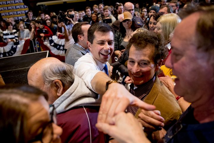 Democratic presidential candidate Pete Buttigieg (center) greets members of the audience during a campaign stop at Iowa State