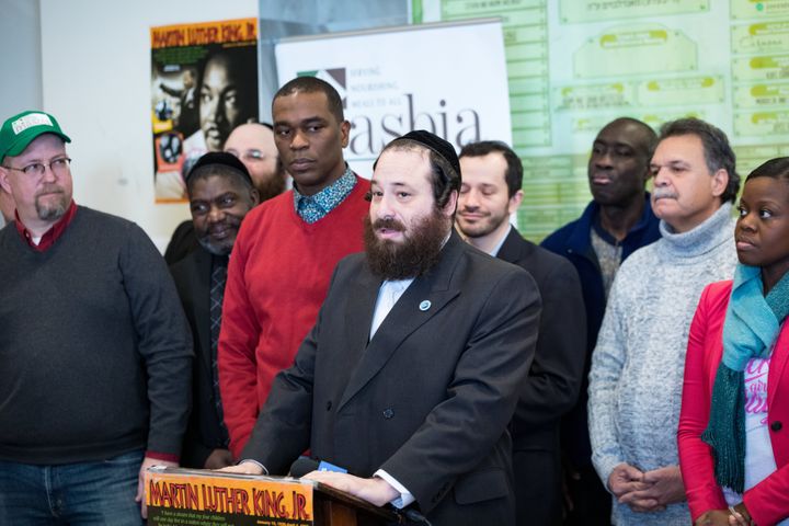 Rockland County legislator Aron Wieder, center, speaks at a Martin Luther King Day event in Brooklyn's Borough Park neighborh