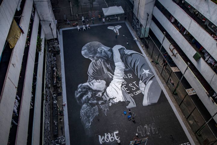 A giant mural of former NBA star Kobe Bryant and his daughter Gianna, painted hours after their death, is seen at a basketbal