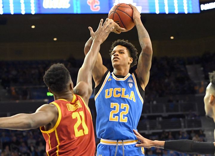 Onyeka Okongwu #21 of the USC Trojans defends a shot by Shareef O'Neal #22 of the UCLA Bruins in a game at Pauley Pavilion on