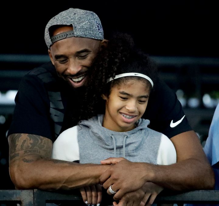 In this July 26, 2018 file photo former Los Angeles Laker Kobe Bryant and his daughter Gianna watch during the U.S. national 