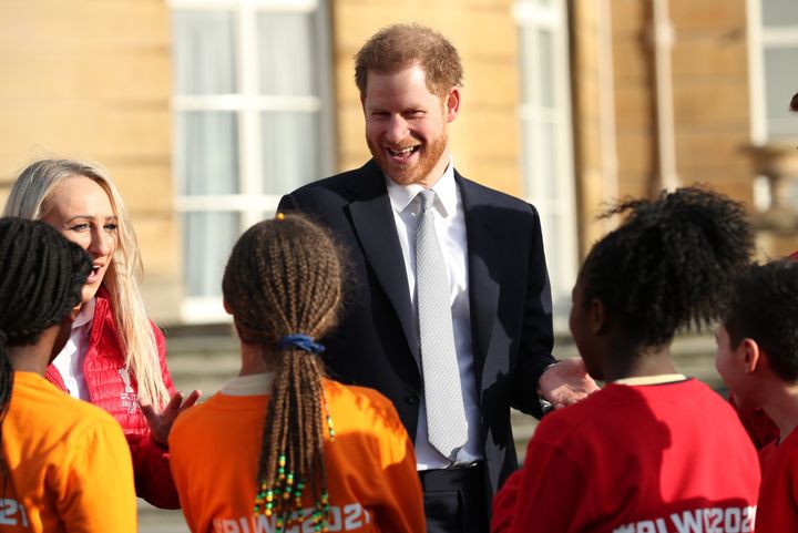 The Duke of Sussex visits with children playing rugby in the Buckingham Palace gardens, as he hosts the Rugby League World Cu