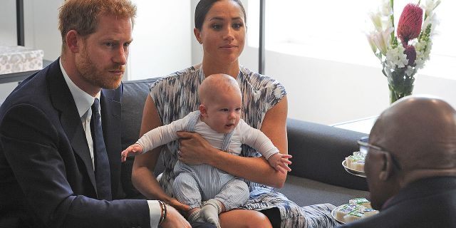 Britain's Duke and Duchess of Sussex, Prince Harry and his wife Meghan hold their baby son Archie as they meet with Archbishop Desmond Tutu at the Tutu Legacy Foundation in Cape Town on Sept. 25, 2019