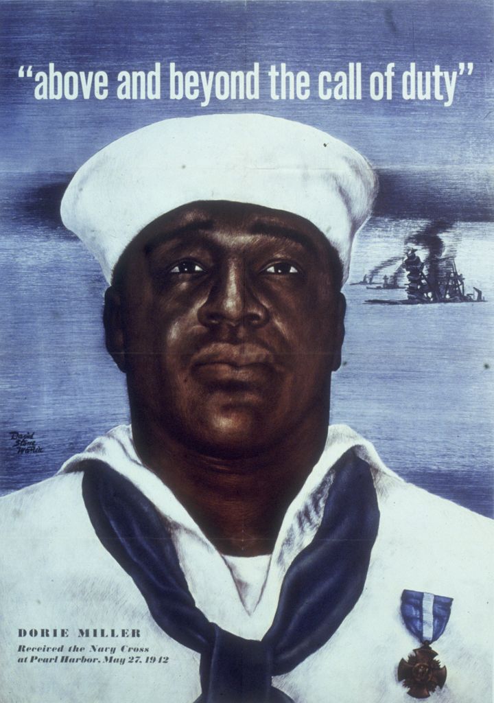 Circa 1942: Headshot portrait of Naval Mess Attendant 3rd Class Doris Miller, wearing a Navy Cross pinned to his sailor's uni
